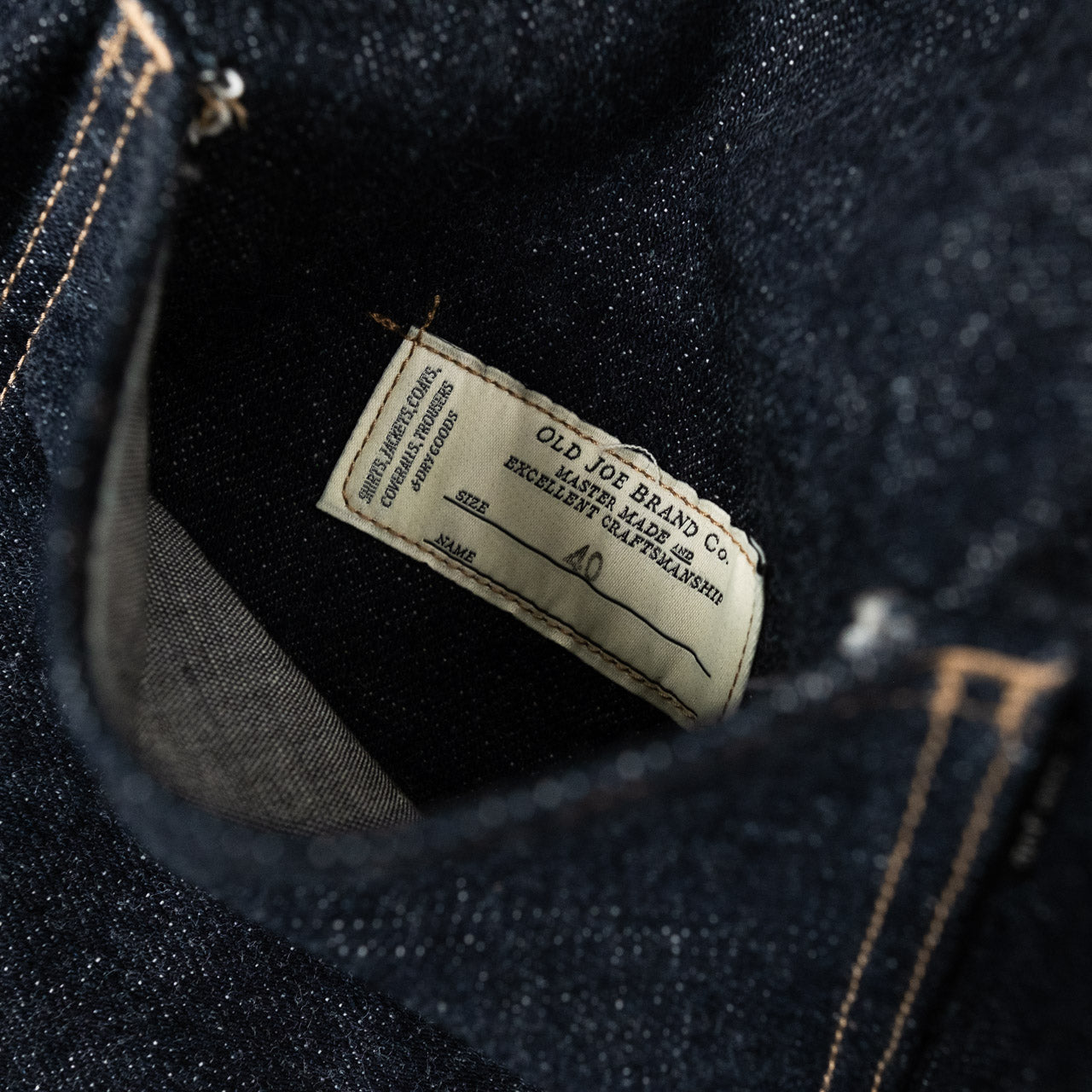 Old Joe Brand One Pocket Jean Jacket Indigo, Detailansicht des Labels in der Brusttasche