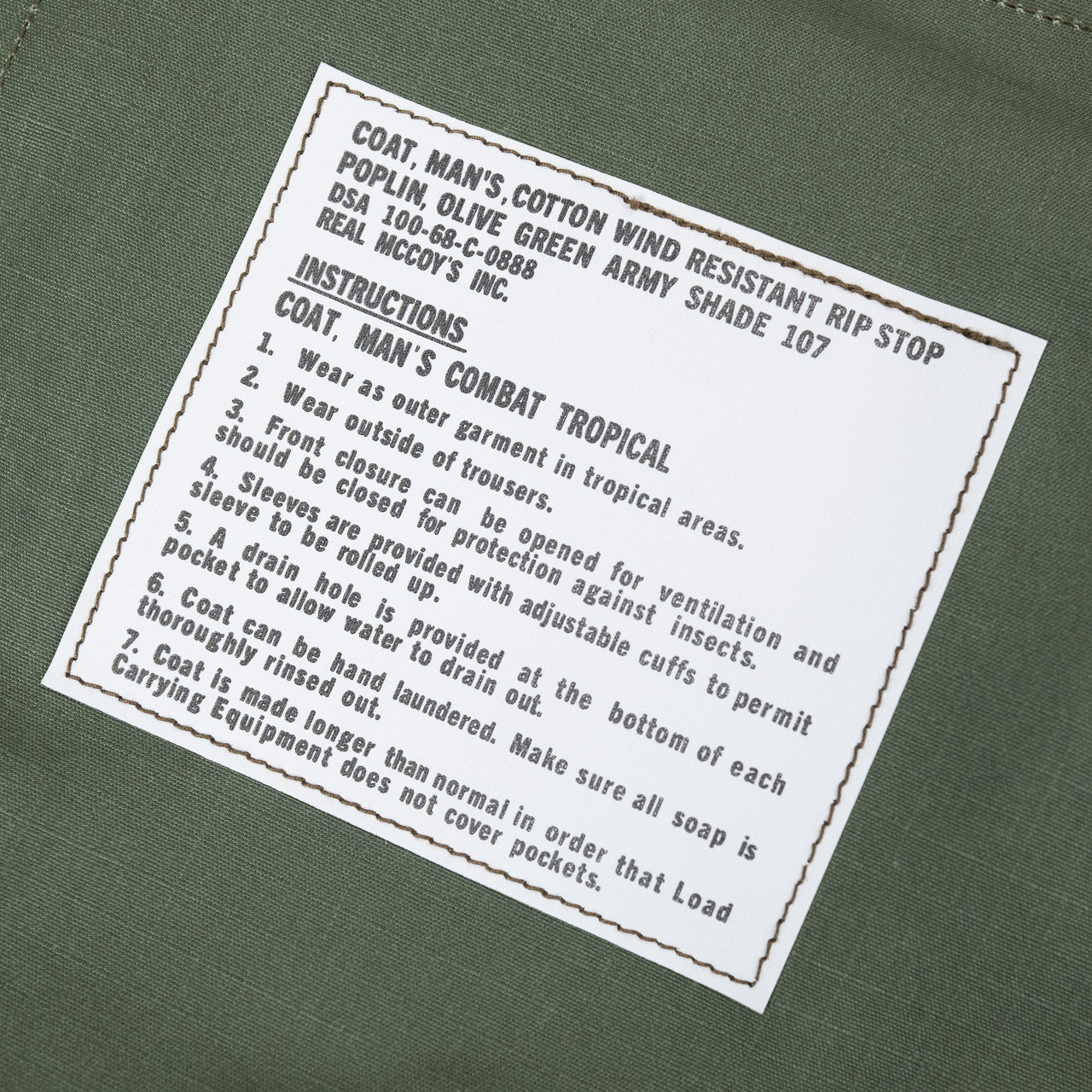 The Real McCoys Ripstop Jacke in Oliv, Detailansicht des Labels auf der Innenseite