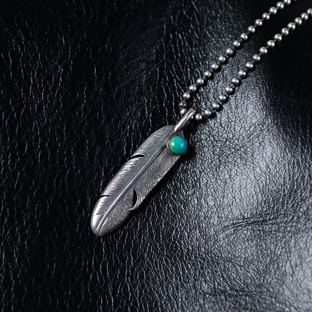 Pendentif plume de corbeau turquoise argent